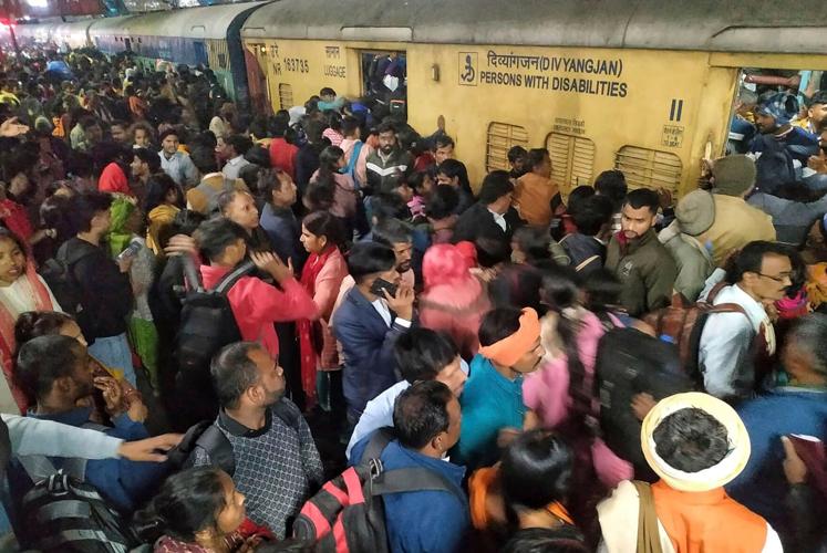 At least 18 dead in crush at New Delhi train station as crowds head for religious festival, Indian media reports