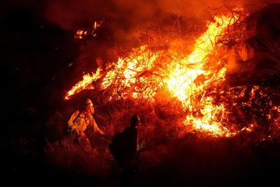 Strong winds remain a threat to Southern California as firefighters bat down new wildfires