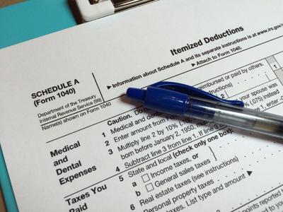 Who benefits most from the state and local tax deduction and why raising the cap is contentious