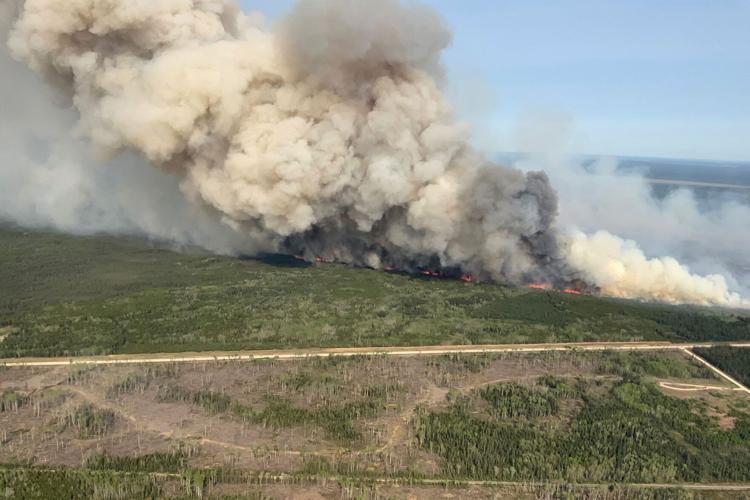 Smoke pours into the US as Canada wildfires force province’s largest evacuation in ‘living memory’