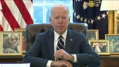 Biden-at-desk-signing-covid-bill-1.jpg
