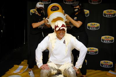 Move aside Gatorade: Food-sponsored bowl games are dumping more creative products on the winning team