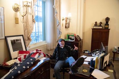 Man who rested feet on desk in Pelosi's office on Jan. 6 found guilty on 8 counts