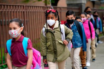 As states plan to lift school mask mandates, CDC remains vague on updating its guidance