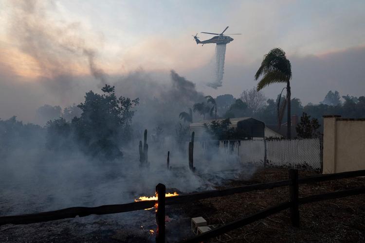 ‘We barely made it out’: Californians desperately flee their homes amid raging wildfires