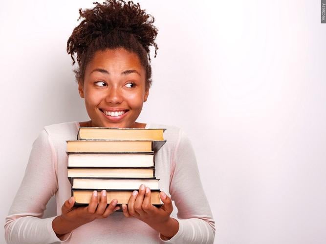 Girl holding books