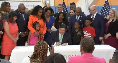 Pritzker signing budget
