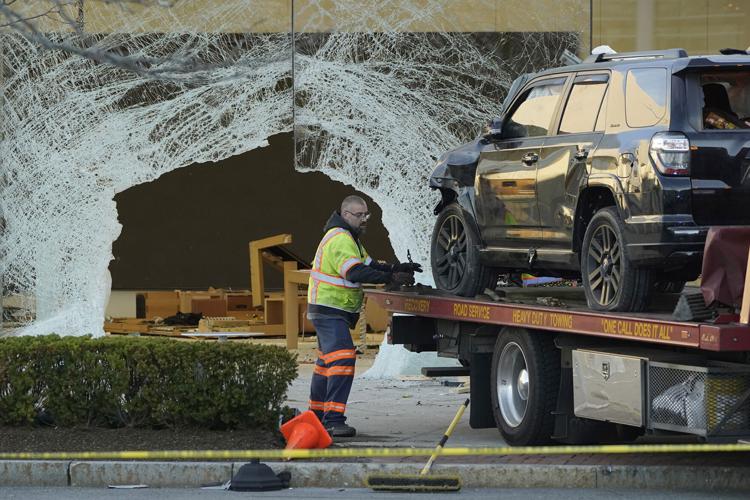 Man arrested after SUV drove through Massachusetts Apple store, leaving 1 dead and at least 20 injured