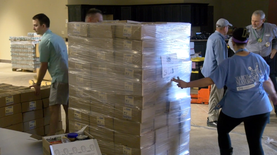 Food collected during March of the Mayors packed in Tupelo News