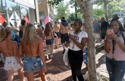 Dozens go topless, braless in Charleston to normalize female bodies