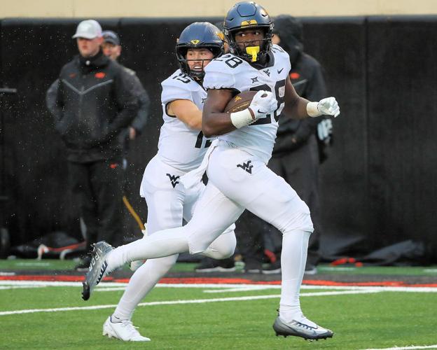 WVU football Anderson's TD runs lead Mountaineers past Oklahoma State