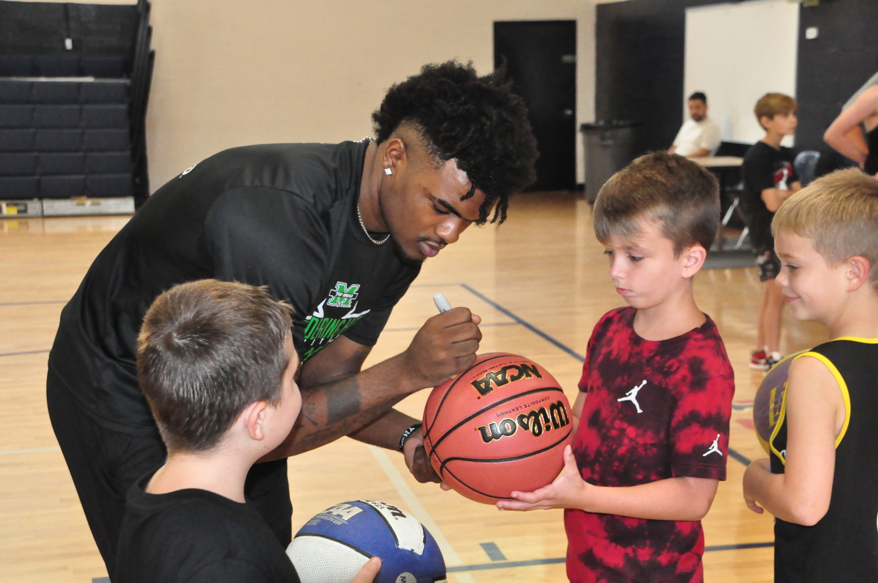 Marshall basketball: David Early gives back with appearance at Man