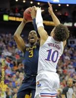 Out in the cold again: Kansas' defense slows WVU in Big 12 tourney