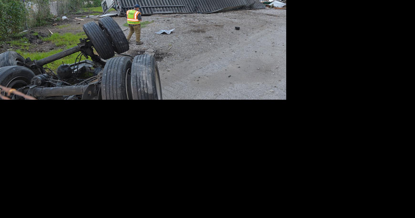 Driver ejected, passenger trapped after semitruck falls off interstate in Charleston