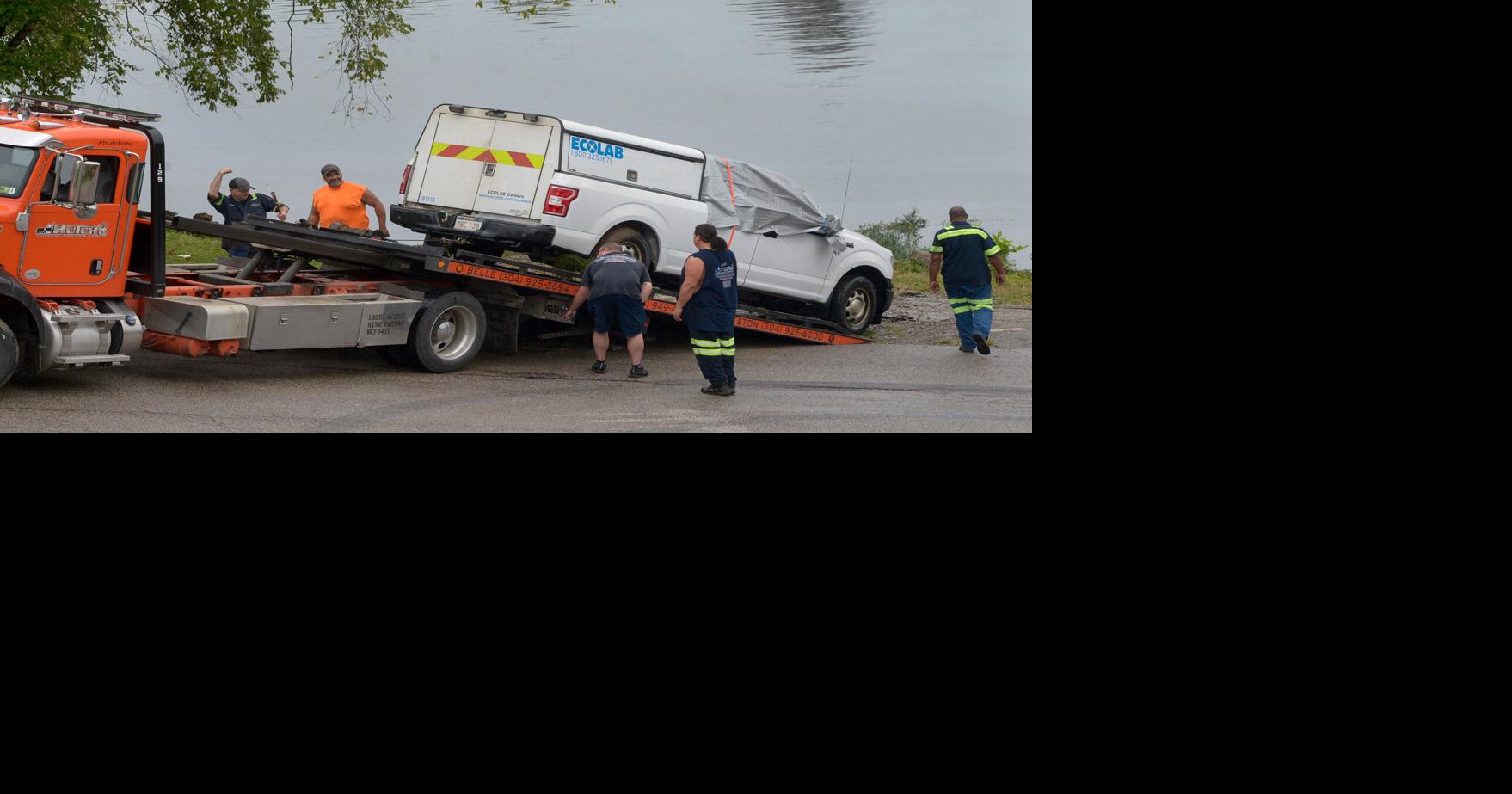 Truck with body winched from Kanawha River