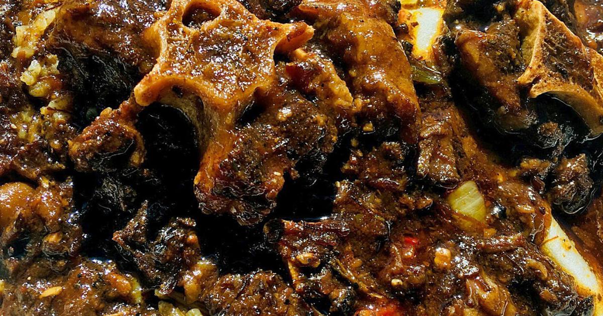 Oxtails and cooked cabbage at Karubee's Jamaican Cuisine
