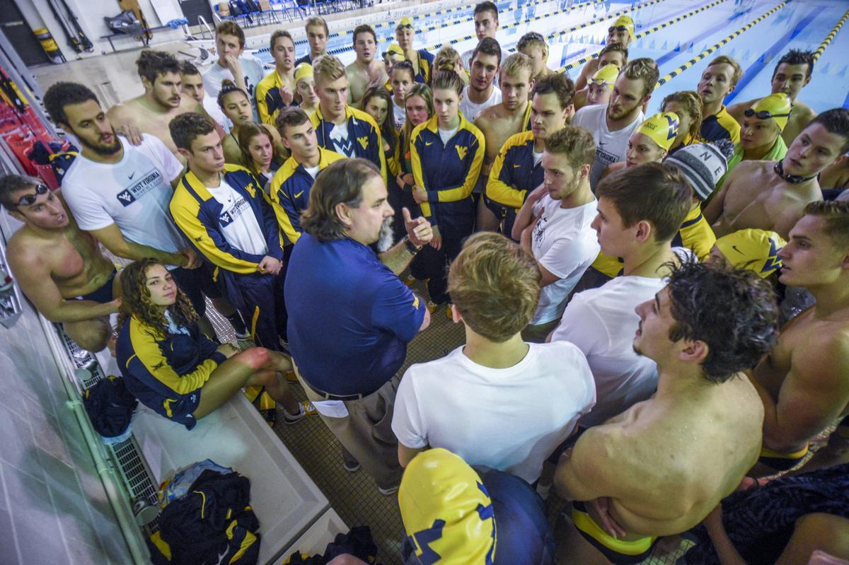 Snapshot of the swimming and diving team huddled