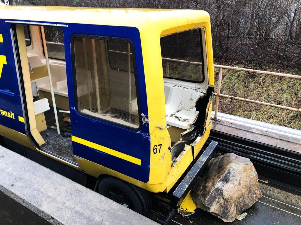 Three taken to hospital after boulder strikes car, WVU PRT News