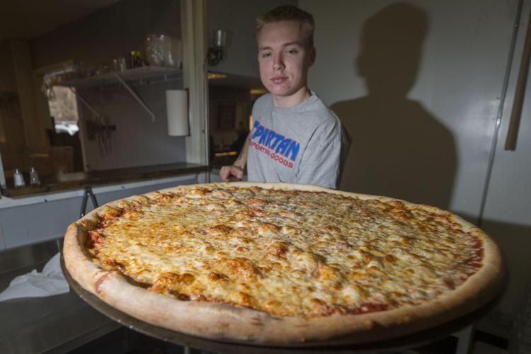 Fayetteville restaurant thinking big with oversized pizza Food