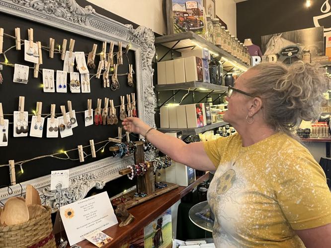 Connie Boggess points out an artisan vendor at Putnam Provisions inside Area 34 in Hurricane.jpg