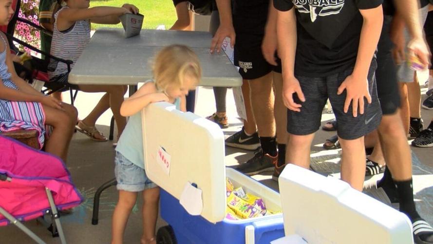 Holmen football team donates to the community Holmen High School