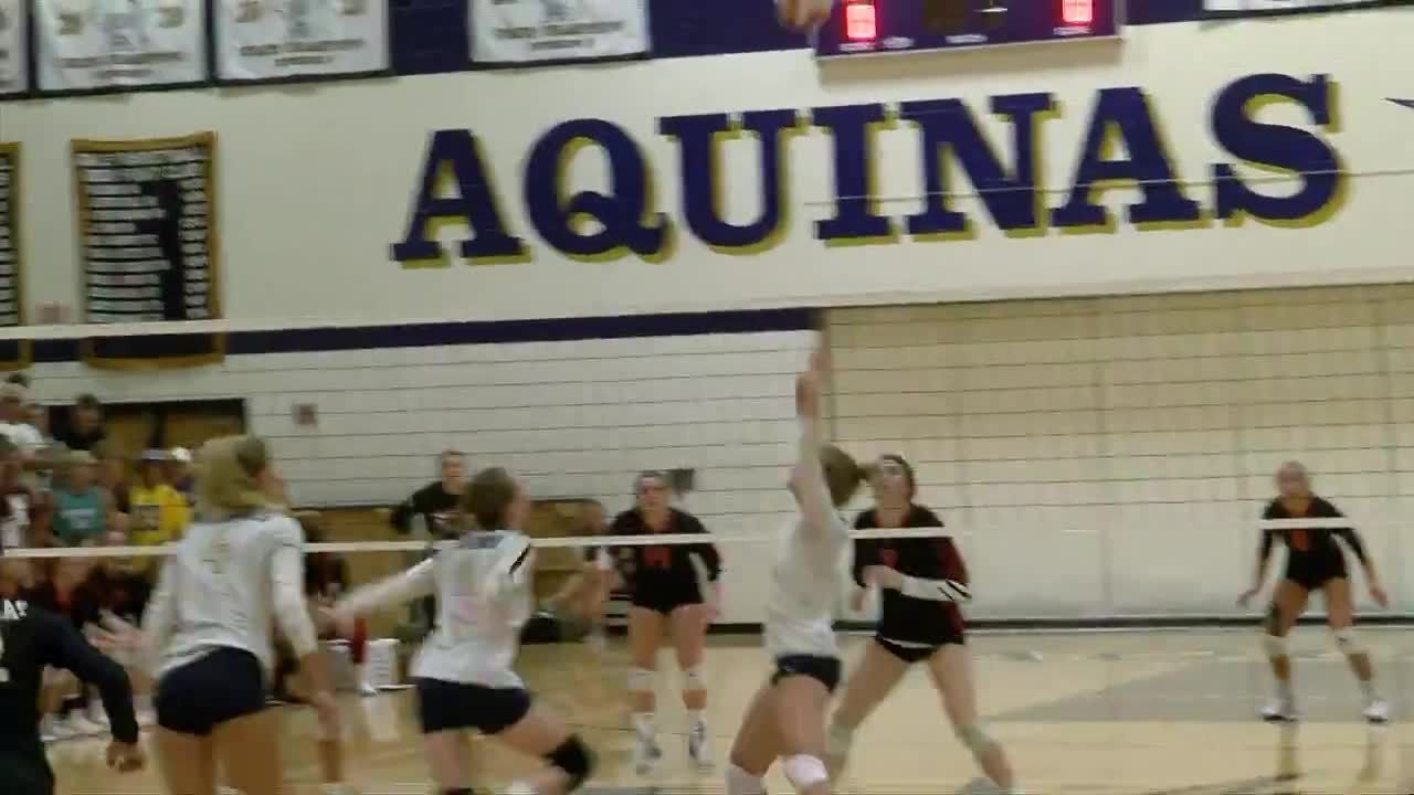 Aquinas spikes Central on the Volleyball court Sports wxow