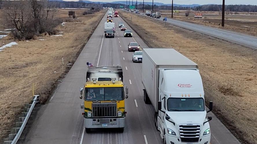 Driver Stunned by 18-Wheeler Convoy Flanked by Trucks and Helicopters on  Highway