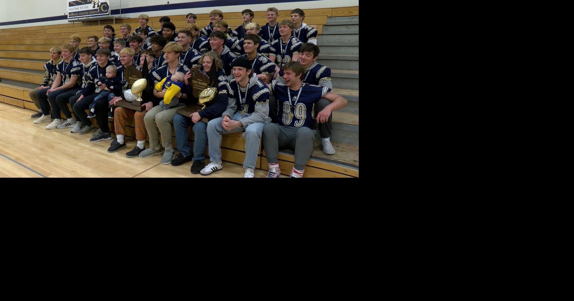 Aquinas celebrates their championship win over Mayville News