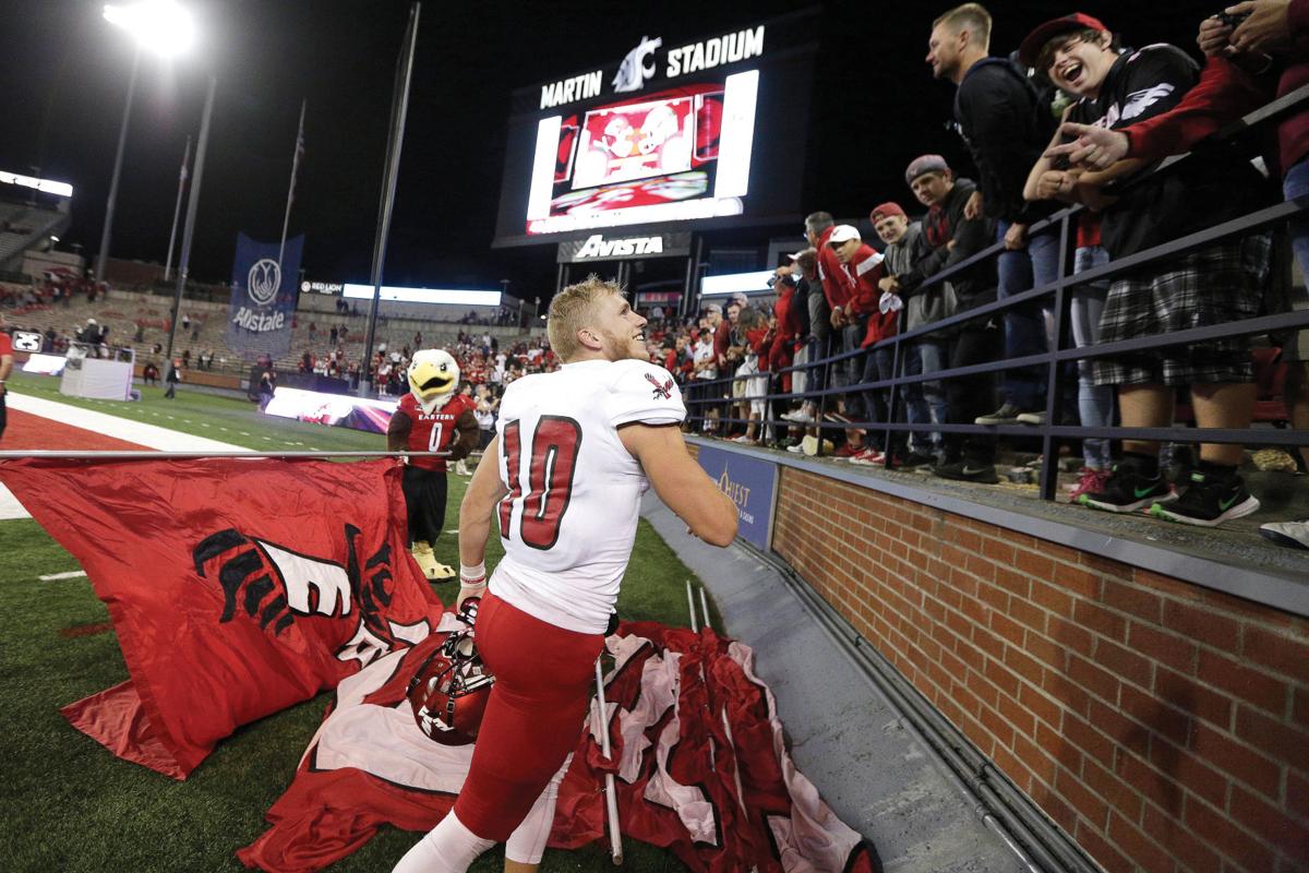 EWU receiver Cooper Kupp celebrates with Eagles fans after his team knocked off Washington State. (Young Kwak/AP via Yakima Herald)