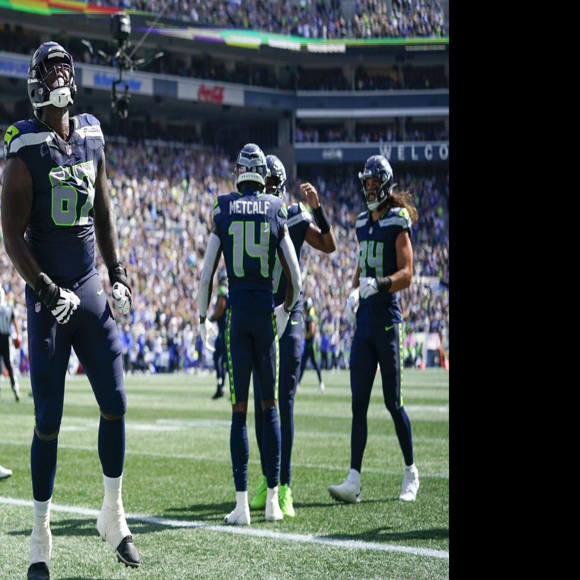 Seattle Seahawks tackle Charles Cross (67) warms up before playing against  the Los Angeles Rams in