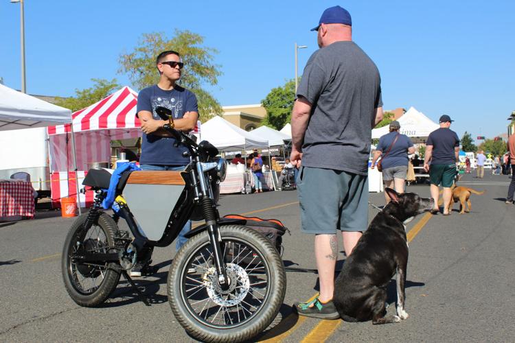 Electric cars and bikes on display at downtown Yakima Farmers Market
