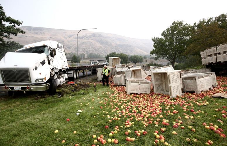 Truck rolls over on U.S. Highway 12, spilling apple bins and briefly