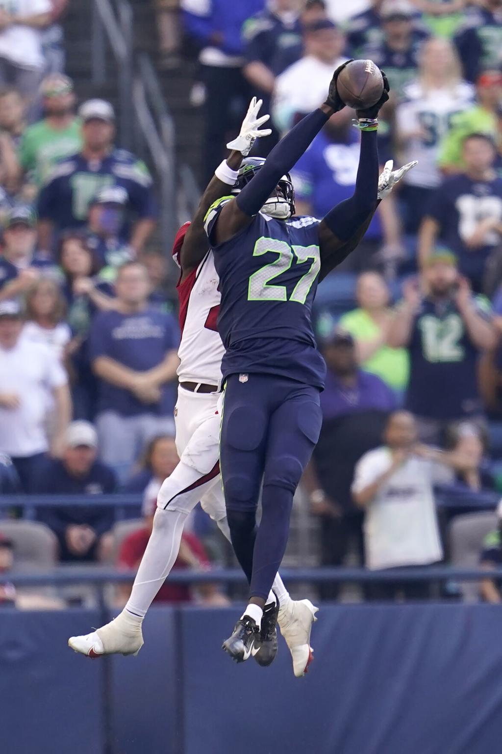 Seahawks rookie cornerback Tariq Woolen continues strong start with another  interception, Seahawks