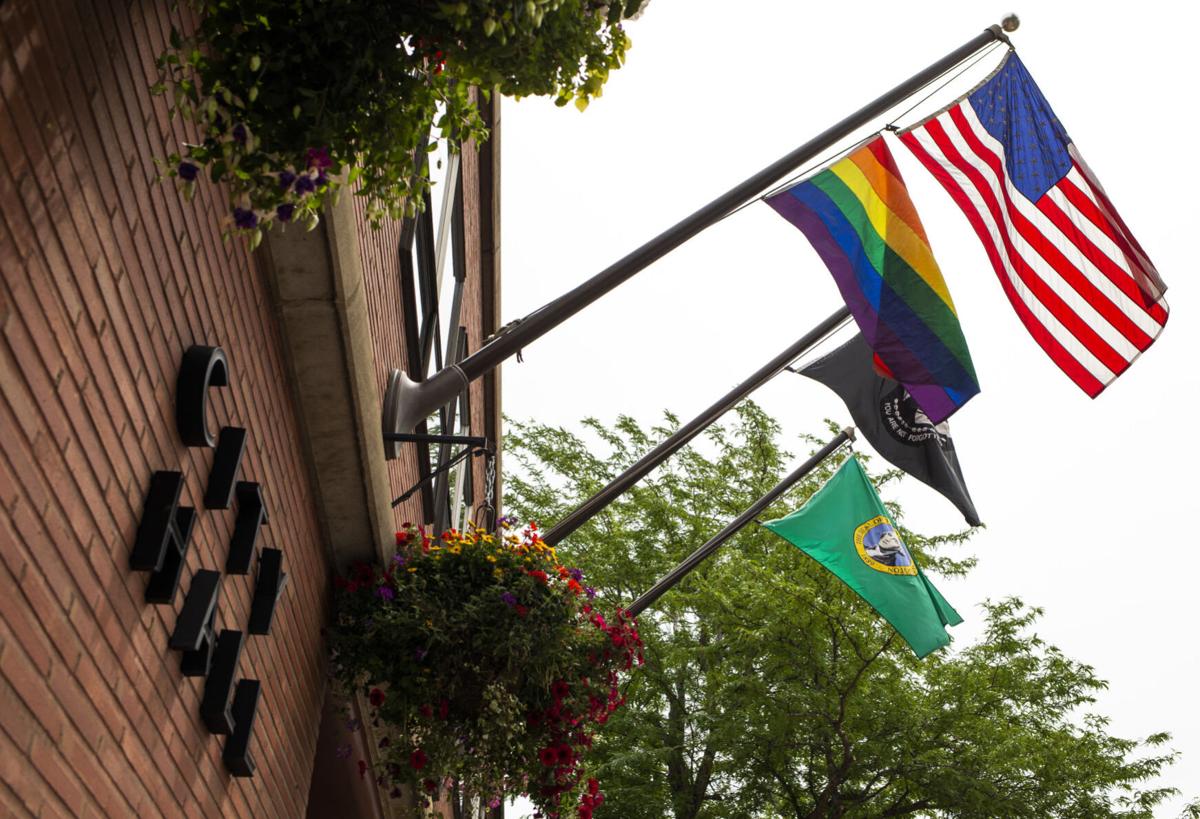 A Pride flag hangs among the American flag, Washington state flag and POW/MIA flag over Yakima City Hall on Friday, June 12, 2020 in Yakima, Wash. 