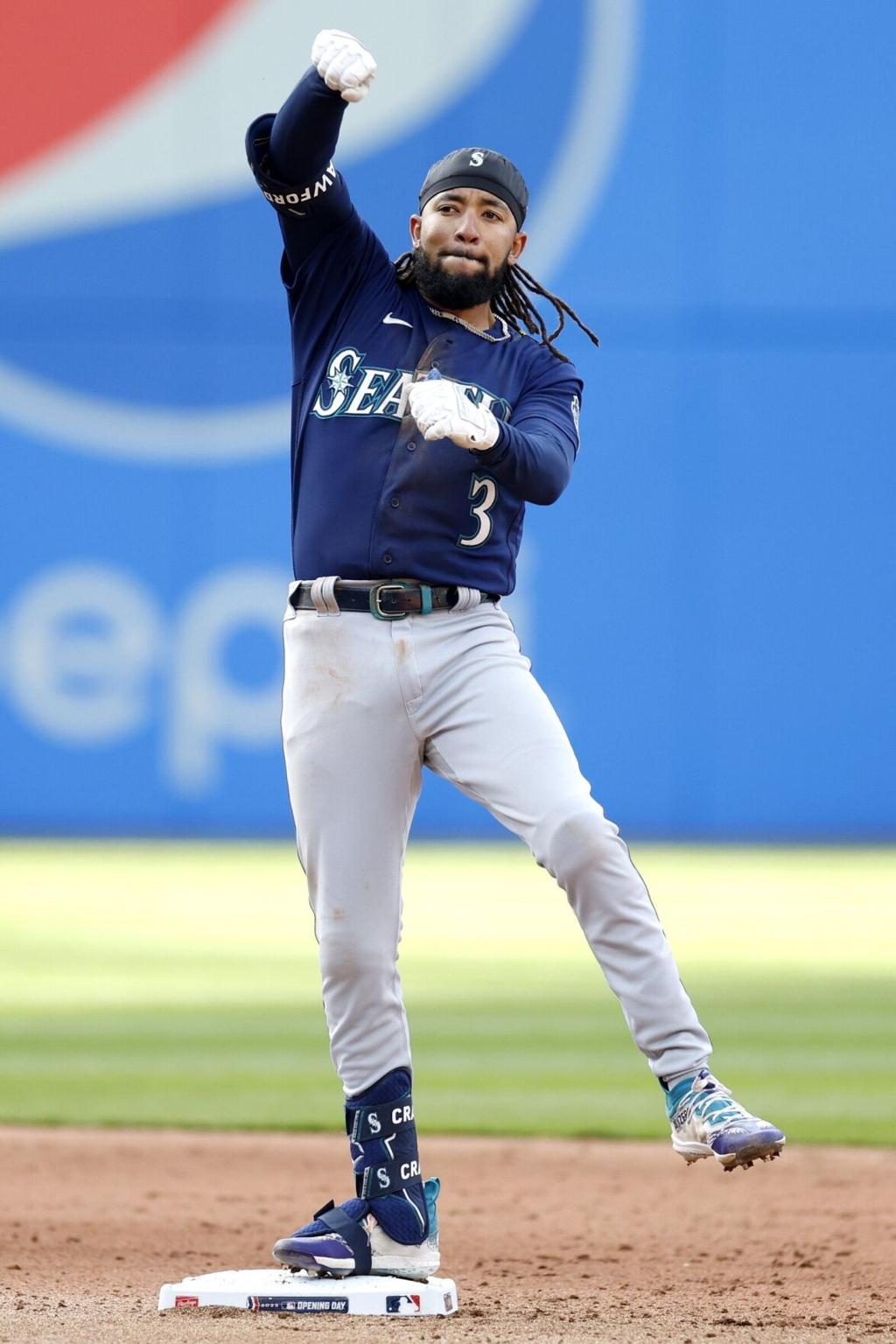 Seattle Mariners' J.P. Crawford breaks his bat on a swing in a