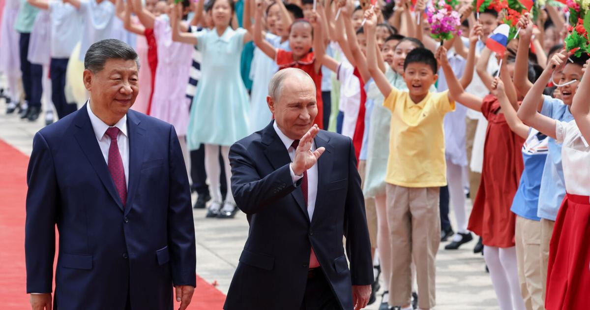 Putin and Xi hail their high-level ties and growing energy trade as they meet in Beijing