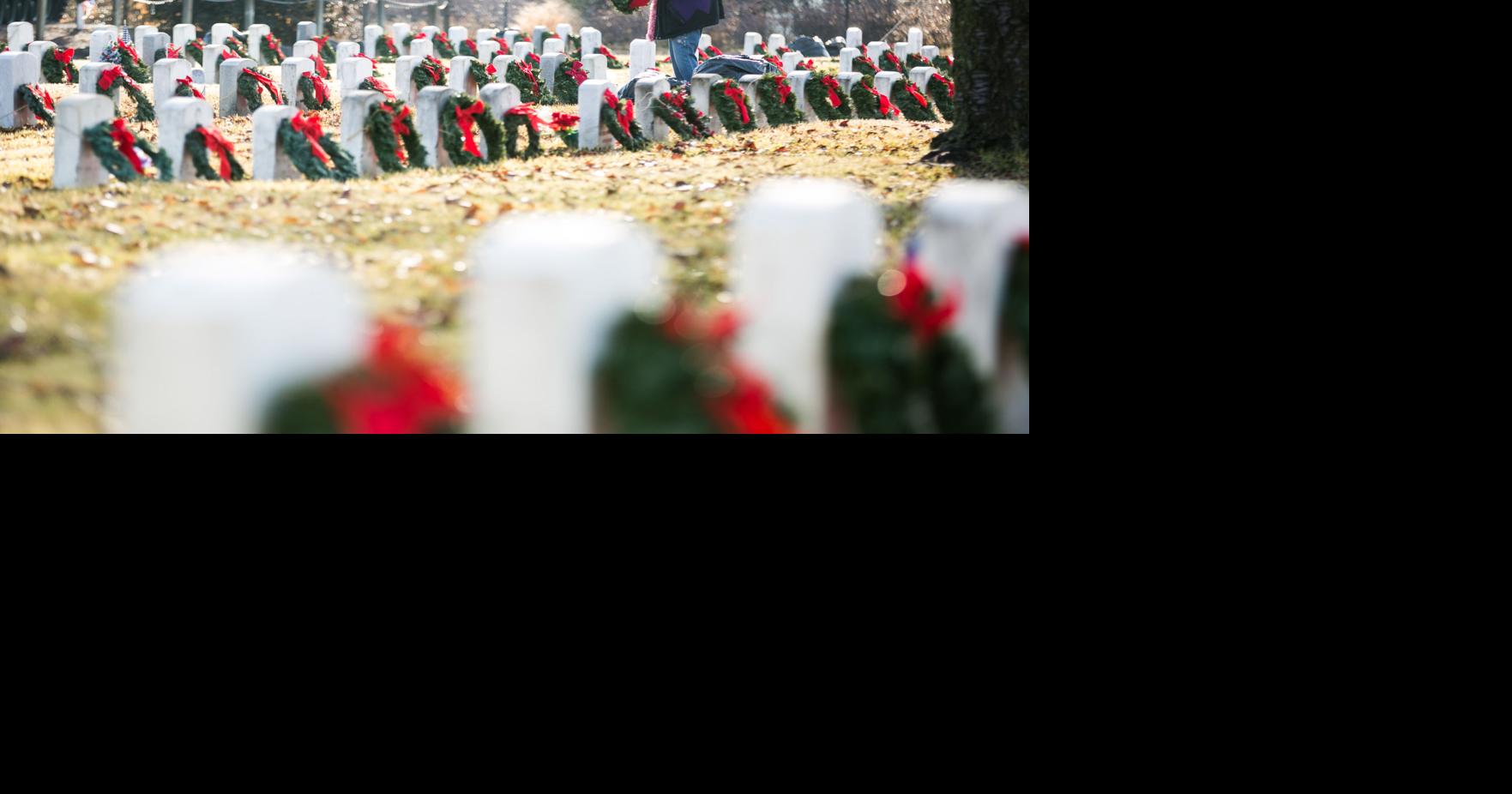 VFW, military and others place holiday wreaths on veterans' headstones