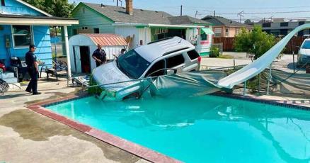 Weird day in Pasco: SUV in swimming pool, garbage truck on fire