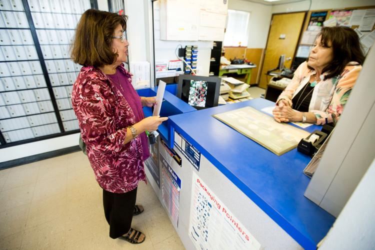 Postmaster of Yakima County’s smallest post office brings cheer to