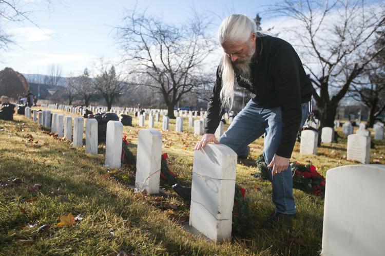 VFW, military and others place holiday wreaths on veterans' headstones