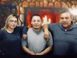 Debbie Salas and Ruben Alvarado pose for a family picture with Evaristo Junior Salas