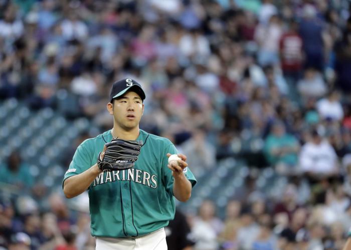 Seattle Mariners pitcher Yusei Kikuchi walks upon his team's