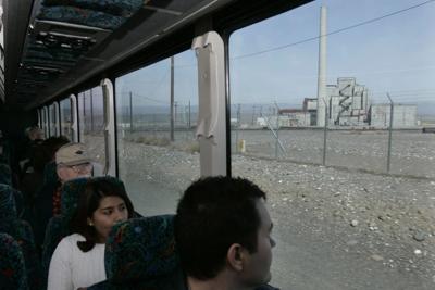 Guests on a bus tour of the Hanford nuclear reservation