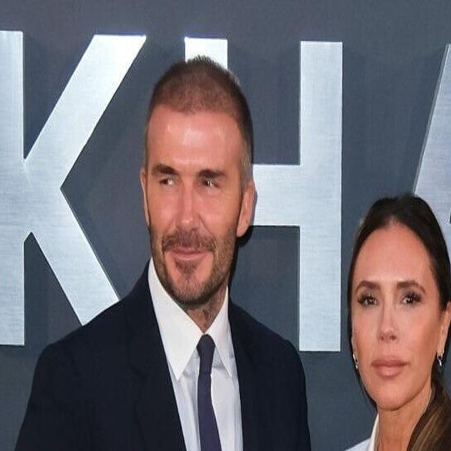 David Beckham walks hand-in-hand with Victoria as they head out