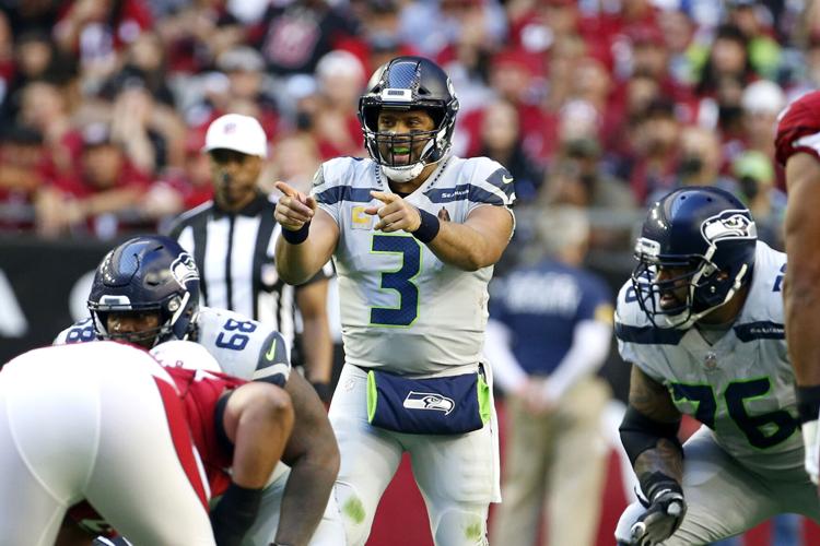 Russell Wilson wants to stay with the Seahawks, but he is frustrated with  getting sacked so often