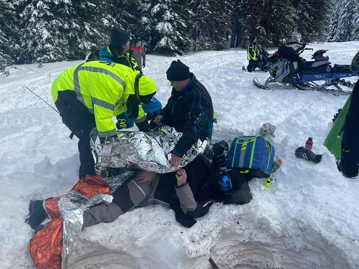 Snowmobiler airlifted off Darland Mountain by Navy helicopter after