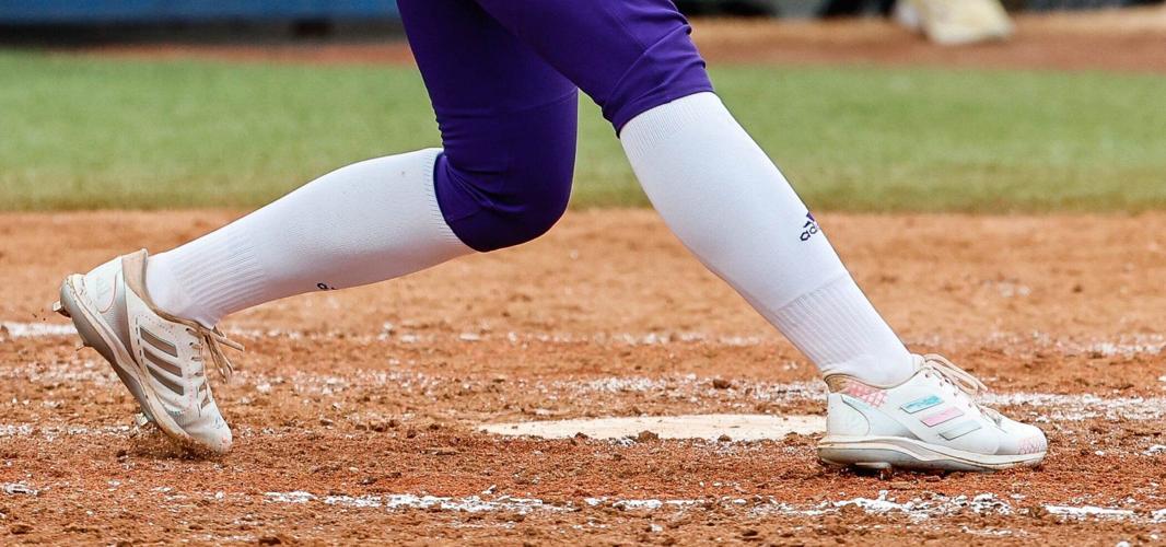 Husky softball players wear cleats decorated by Seattle Children’s