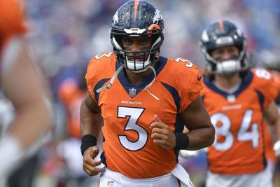 Broncos quarterback Russell Wilson greeted with boos in return to