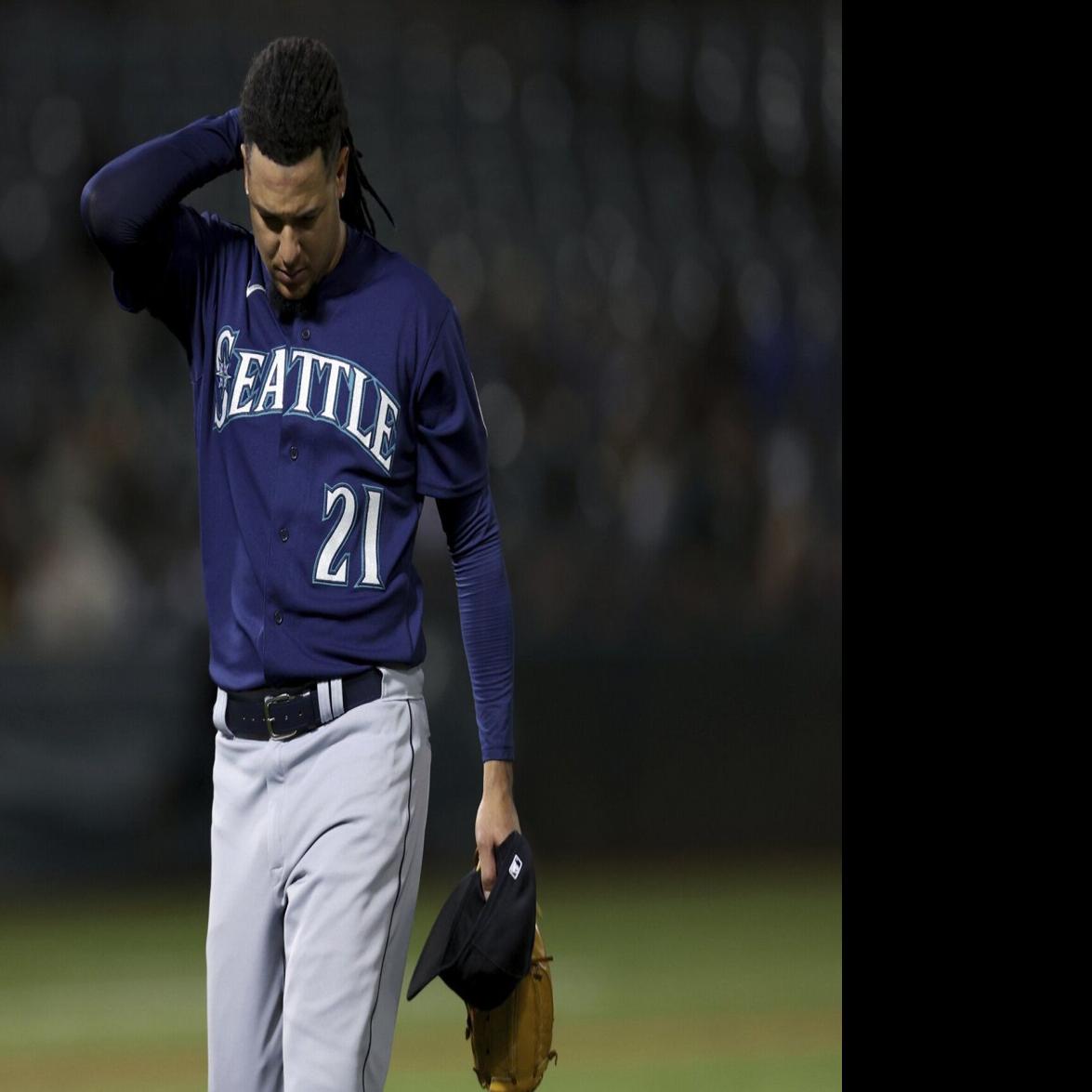 Seattle Mariners' Sam Haggerty walks to the dugout during a