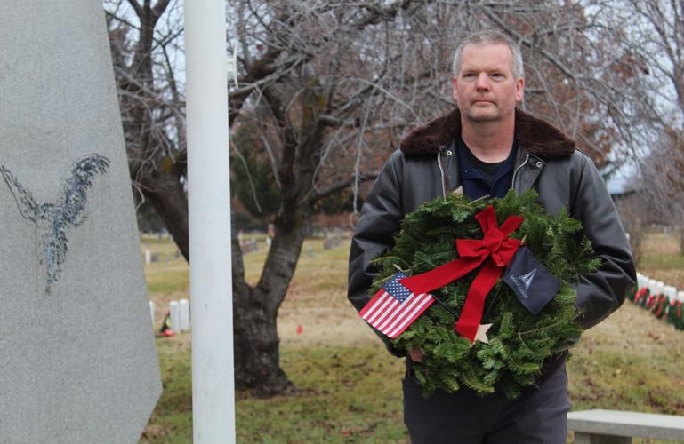 Honoring the fallen Veterans place wreaths on graves at Tahoma